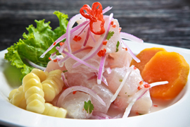 The Peruvian national dish is like no other one reflecting the coastal cuisine and its influences. Ceviche is the most popular dish in Peru and the pride of all Peruvians. While there are hundreds of variations, the traditional Ceviche actually just needs 5 simple ingredients: fresh, raw, white fish filet cut into bite-size pieces, marinated and "cooked" in lime juice and seasoned with Peruvian chili peppers, onions and salt